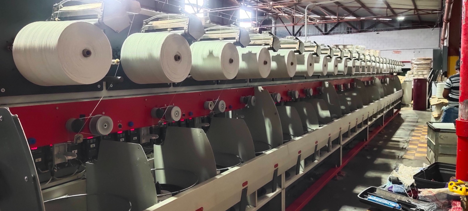 DTX Twisting With Precision Winding for Tape Yarns